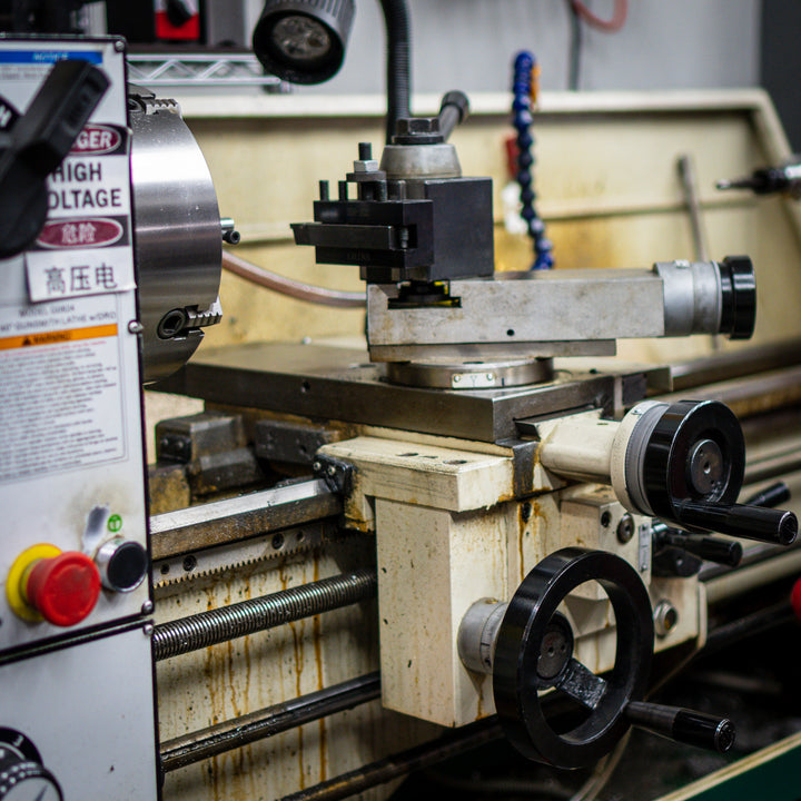 Industrial lathe machinery treated with Tactikel NST for reduced wear and extended equipment life